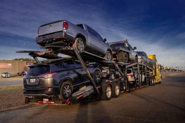 "Car Shipping California - open car carrier hauling trucks and SUVs"