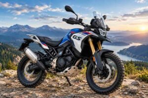 2027 BMW F 450 GS adventure motorcycle on a scenic mountain road.
